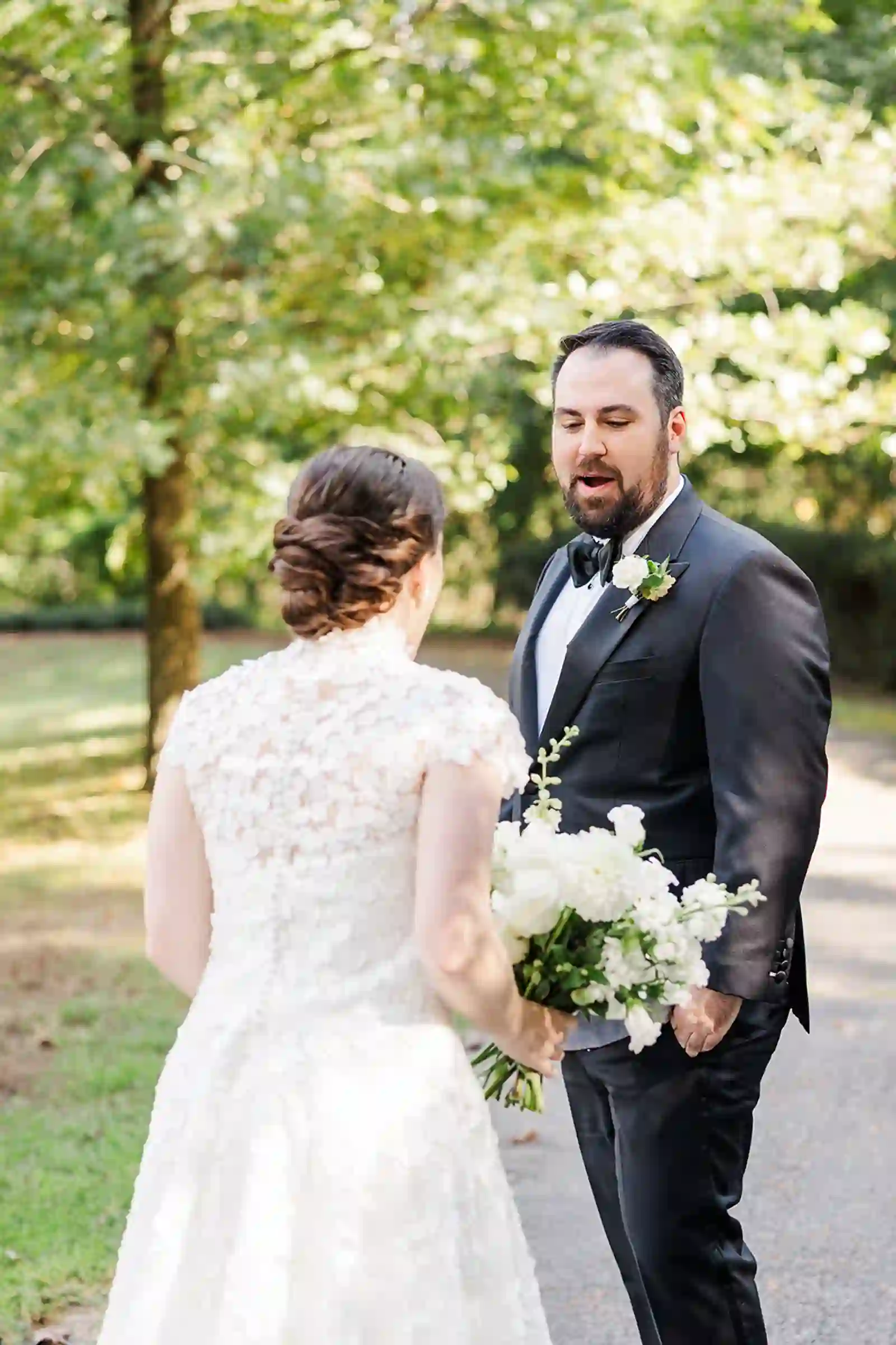 Groom reacting during the couple's first look outdoors