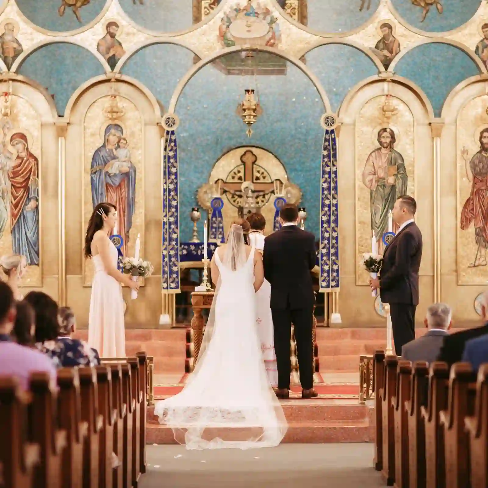 Bride and groom at the altar from the aisle