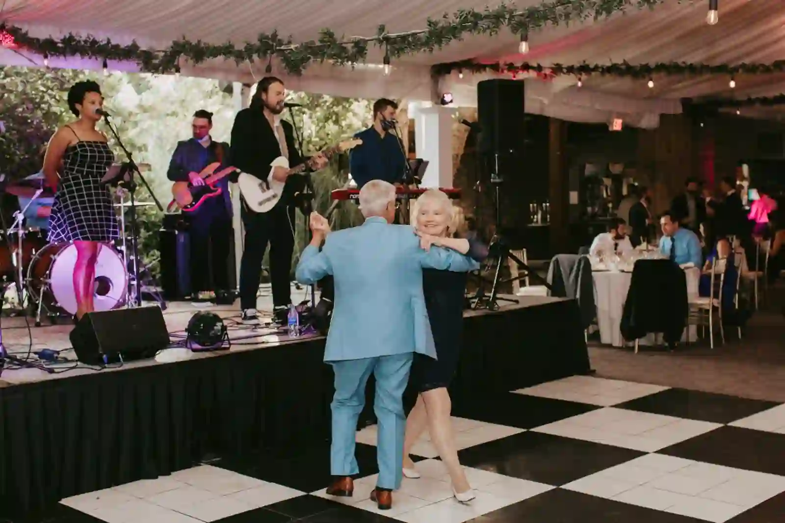 Guests dancing as the live band plays