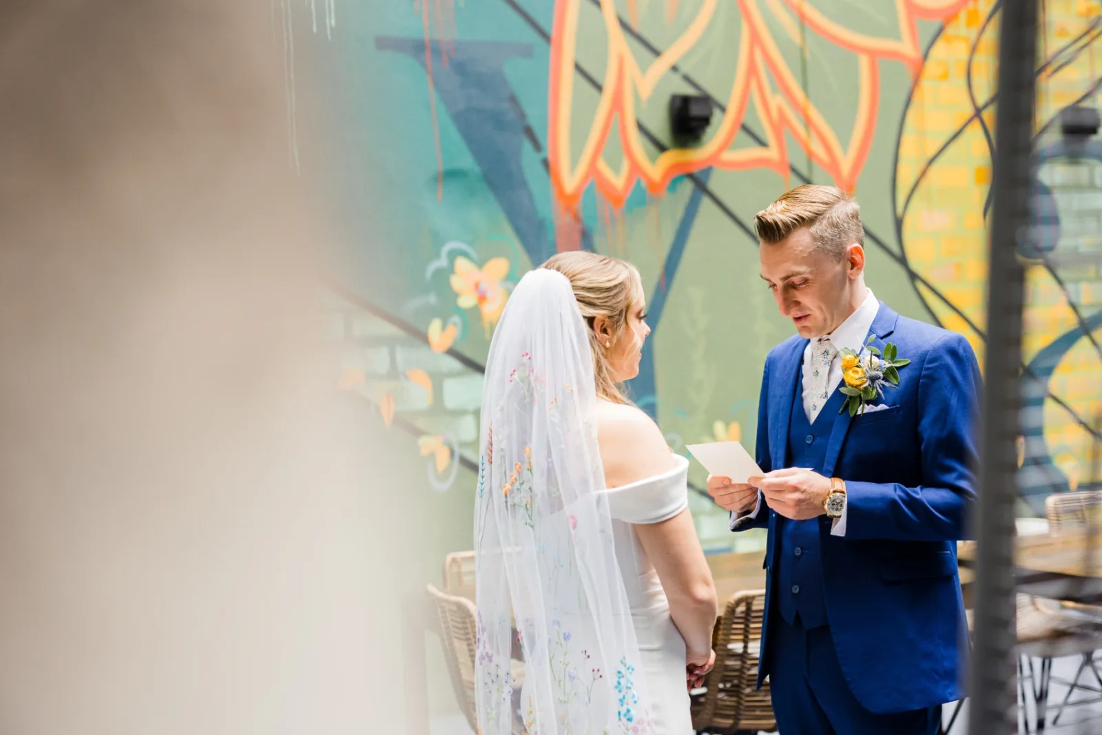 Groom reading vows to bride