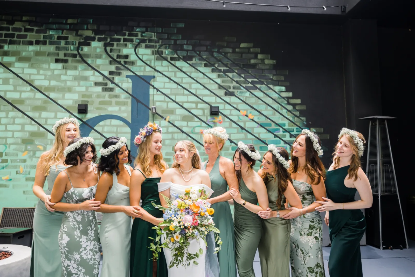 Bride with bridesmaids in sage green dresses