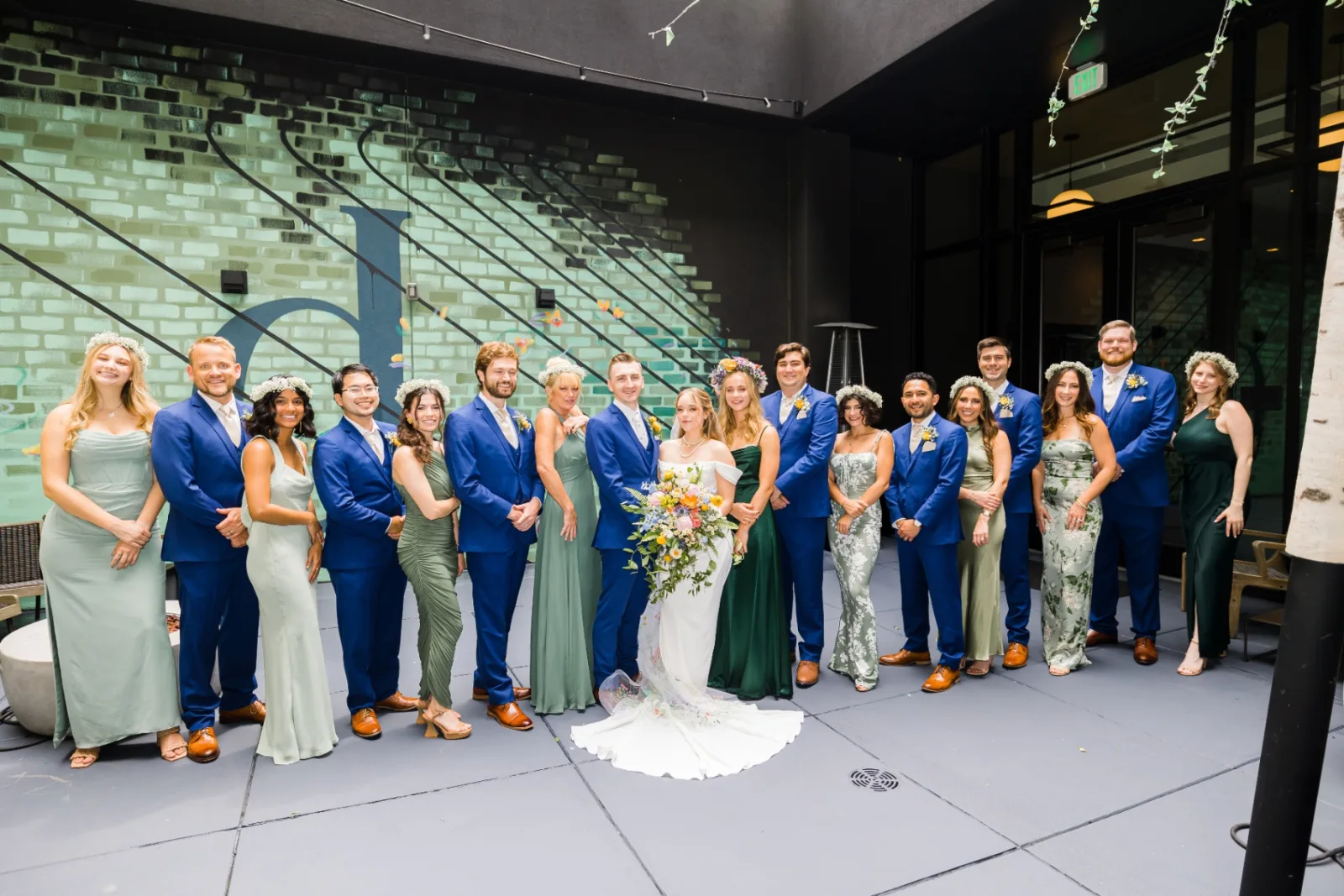 Wedding party portrait with bride and groom centered