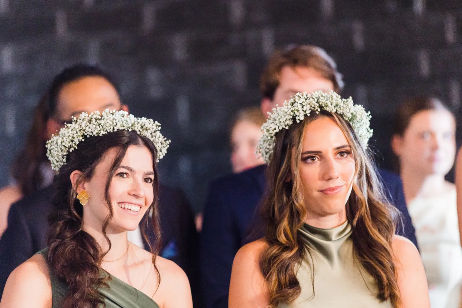 Bridesmaids reacting during the ceremony