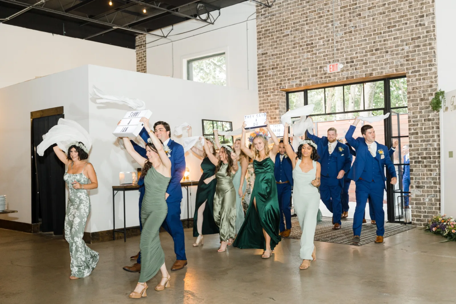 Wedding party entrance with napkins overhead